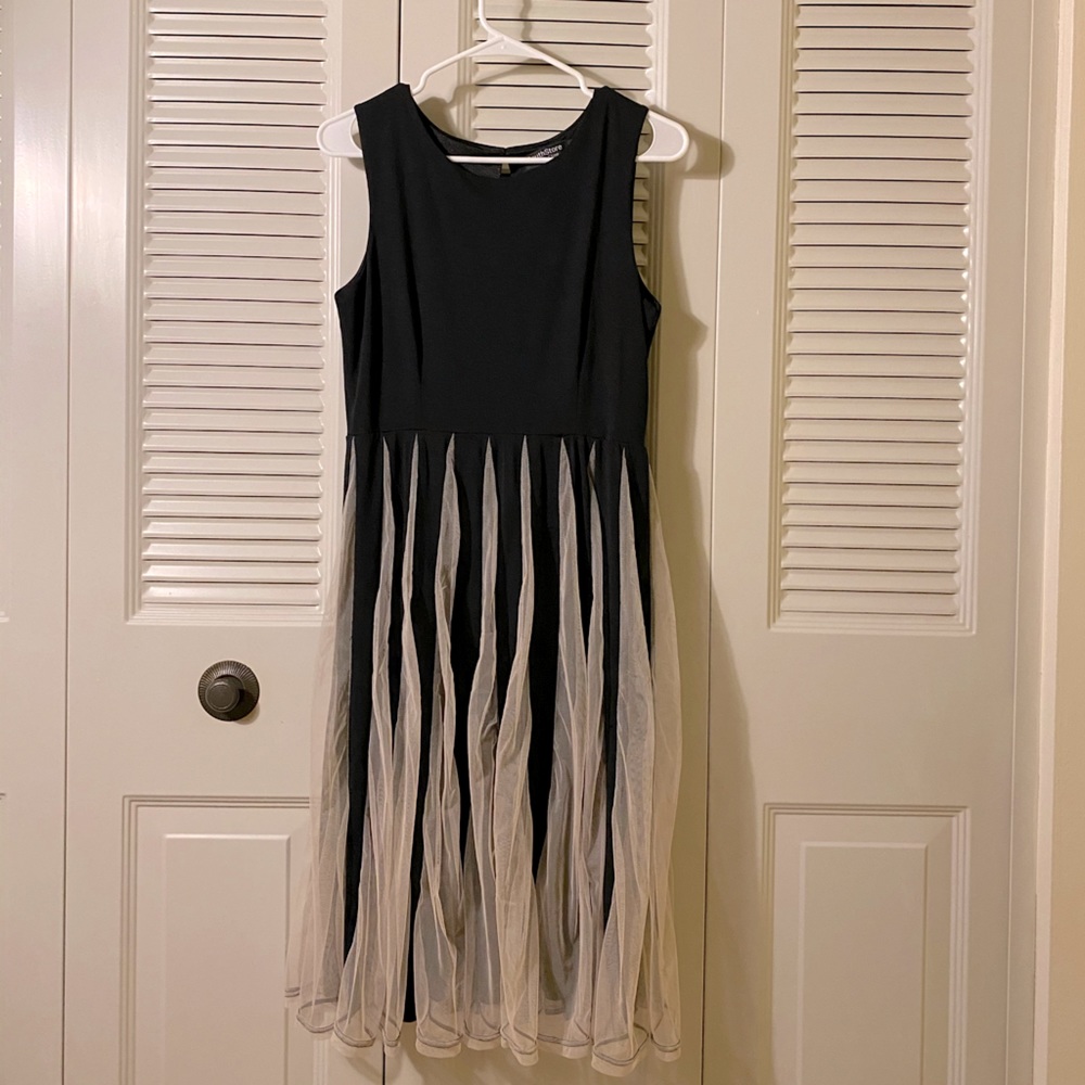Black midi dress with white frills
